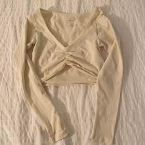 Free People cream long sleeved crop top